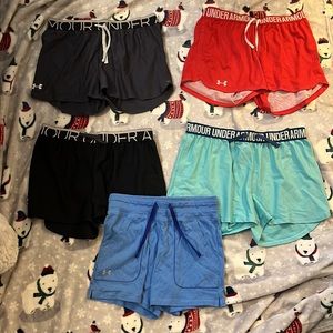 5 pairs of girls XL under armour shorts. (blue pair of shorts is in size large!)